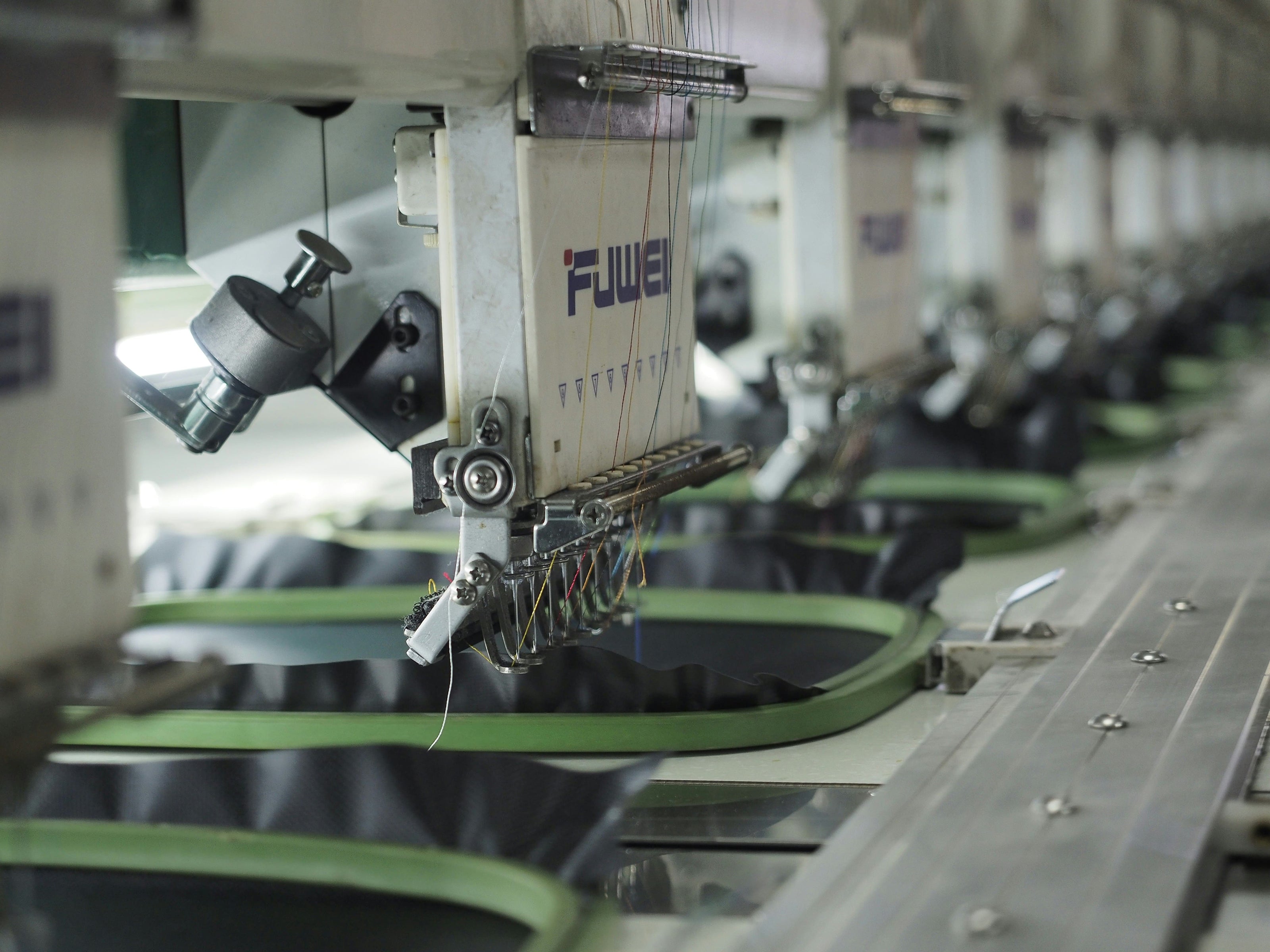 Textile production line with FLUWEI machines in a factory setting